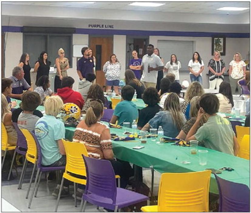 The La Grange football program participated in a “Helmets and Heels” Italian Potluck dinner Tuesday night at the La Grange High School cafeteria to honor football, dance and cheer participants and their mothers and mother figures.