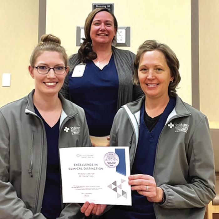 St. Mark’s Advanced Outpatient Wound Center front row, left to right: Jackie Faigle, FNP-C, and Stacie Schramek, RN; back row: Jennifer Scott, RN Program Director.