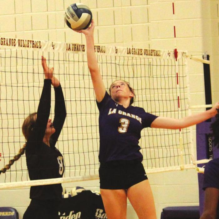 La Granges Hailey Hill tips the ball at the net in action Tuesday at home against East Bernard. Photo by Jeff Wick
