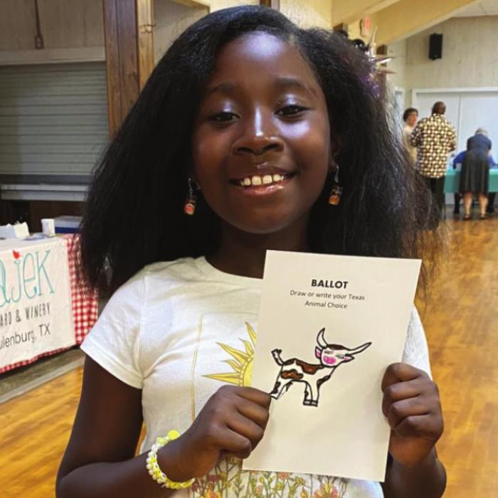 Brieyelle Moore, a soon-to-be fifth-grader at Schulenburg Elementary School, casts her ballot for the longhorn in the League of Women Voters’ Texas animal election.