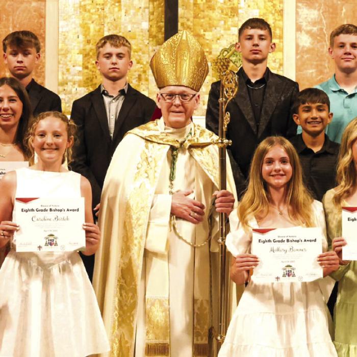 Bishop Presents Awards to St. Rose 8th Graders