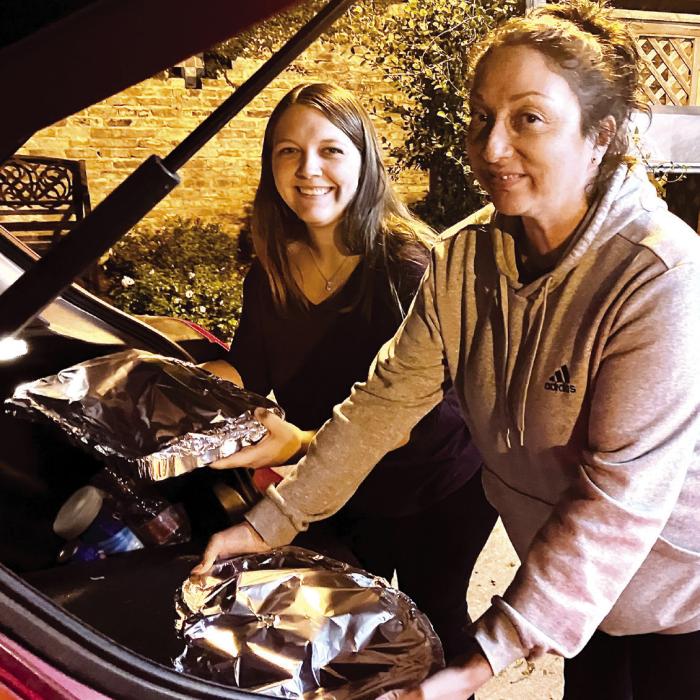 St. James Holy Smokers Cook For Area Families