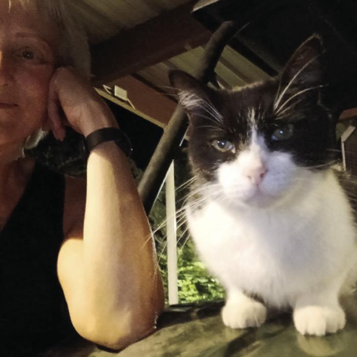 Jeri Welter and her cat Buddy, who she found after he was missing for 100 days in La Grange.