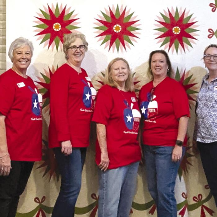 Pictured from left: Kim Bonewald, Terri Wagner, Peggy Halamicek, Donna Burton, Lisa Slinkard, Kim Joost, Susie Grider, and Deborah Blanchette Bradley, museum Managing Director.