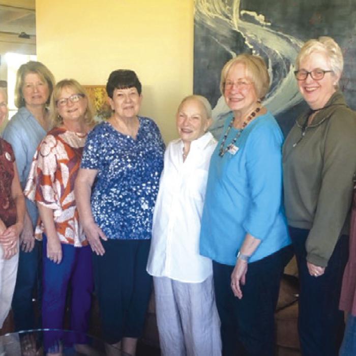 Members of the Fayette County Retired Teachers Association flank presenter Suzanne Batchelder, fourth from the right.