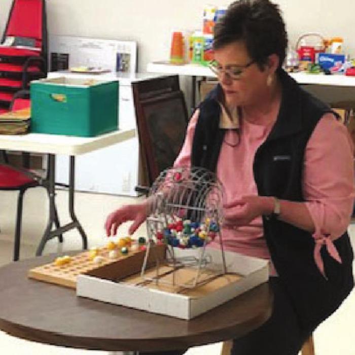 Cheryl Brossman, from Fayette Savings Bank, calling Bingo at the Center last week.