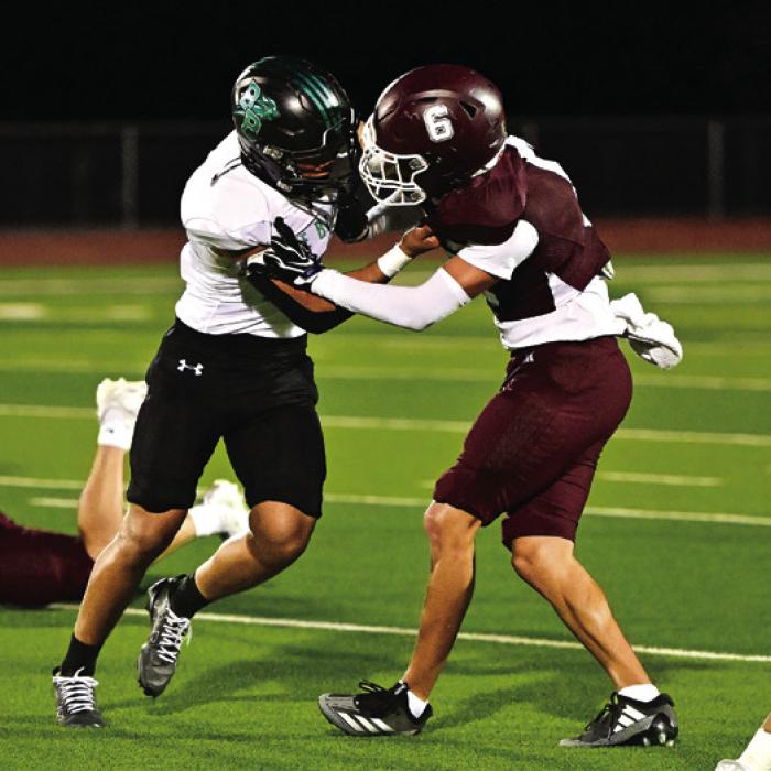 Flatonia’s Freddy Manzano faces off with a Bloomington Bobcat in Friday’s district win. Photo by Stephanie Steinhauser