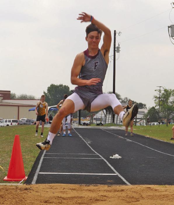 Fayetteville’s Brody Dooley won the district title in the boys long jump. Photo by Ann Pape