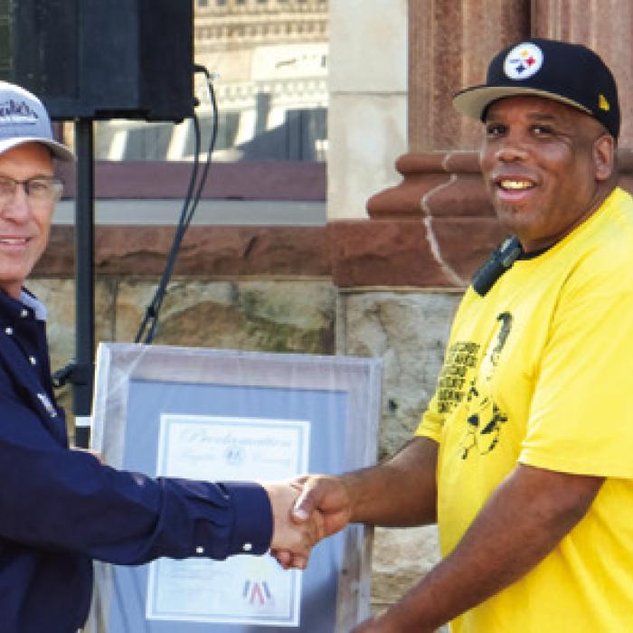 La Grange Juneteenth Committee President Walter Culberson (right) presents a proclamation to David Kleiber of Kleiber Tractor and Equipment thanking the company for sponsoring the event. Photos by Andy Behlen