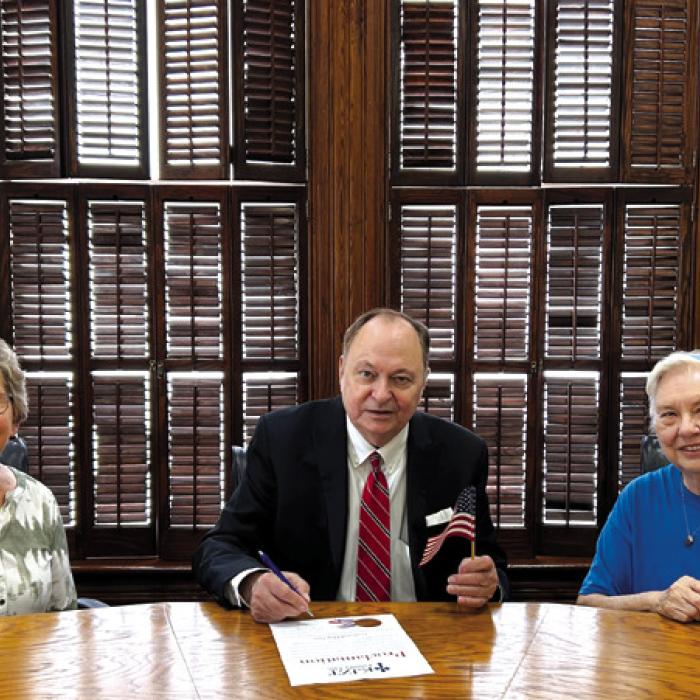 Judge Mueller signed a Proclamation designating June 14, as Flag Day in Fayette County. Witnessing Judge Mueller sign the proclamation were Helen Faldyn, and Lillian Kallus representatives from KJZT Family Life. Pictured from left are Helen Faldyn, County Judge Dan Mueller and Lillian Kallus.