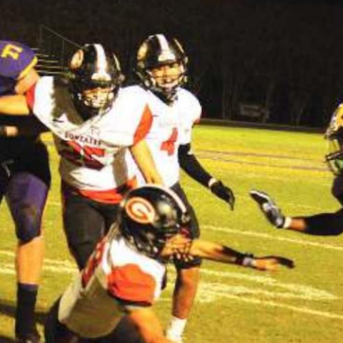 La Grange’s Matthew Johnson flees from a trio of Gonzales tacklers in last week’s game. Photo by Jeff Wick