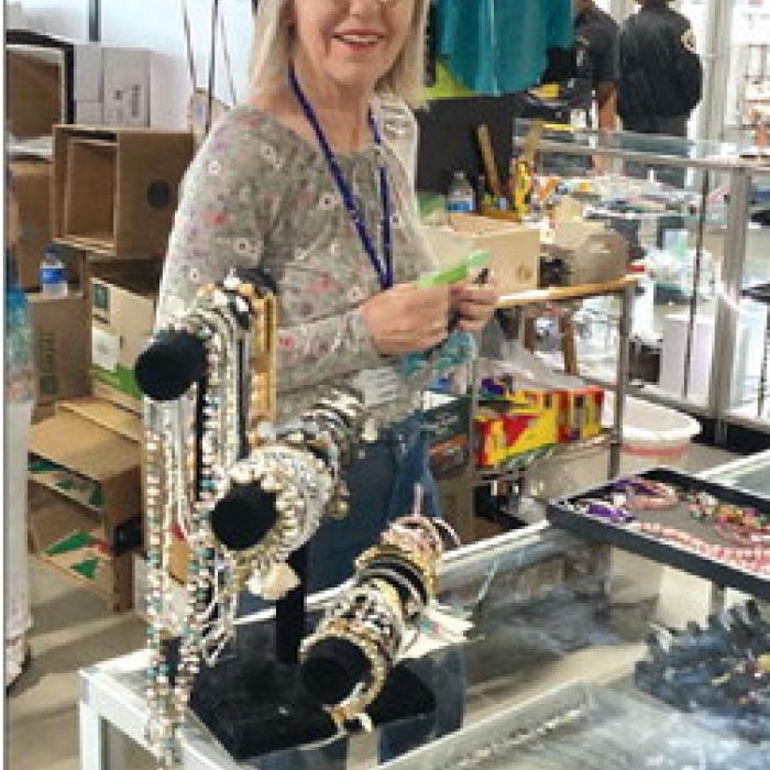 Cheri Balla, a dedicated volunteer from St. James working the bustling jewelry counter.