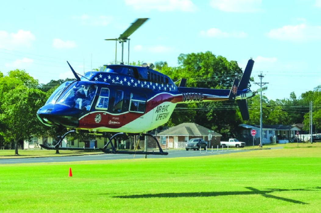 A helicopter from Air Evac Lifeteam departs a landing zone at the La Grange High School practice field last October to transport a man who suffered medical emergency. Air Evac closed its base in La Grange last week. Record File Photo