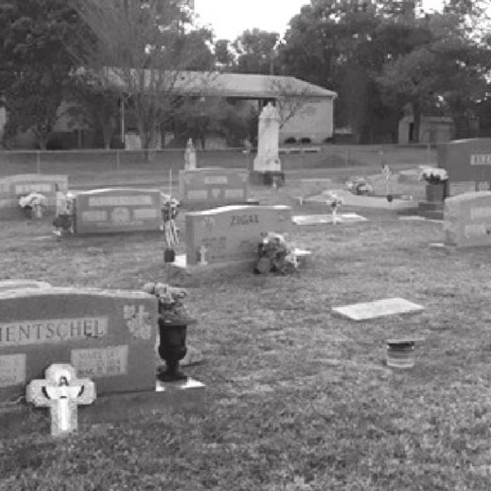 Older Scherrer family graves seen near the back of the photo located in the New La Grange City Cemetery. Photo Courtesy of Katie Janda