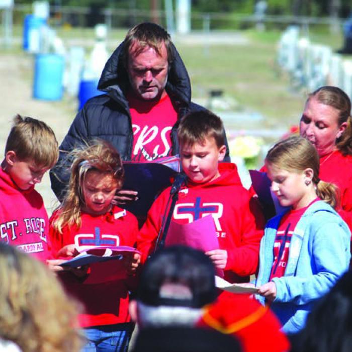 Students and teachers from St. Rose School recited the Pledge of Allegiance and sang “America the Beautiful.”