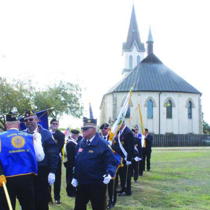 Veterans and Knight of Columbus assembled before the program as St. Mary’s church in Praha towered behind them.