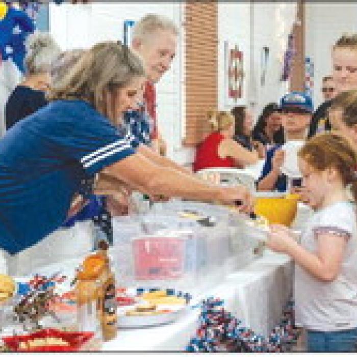 Winchester youth line up for the Ice Cream Social held at Zilss Memorial Hall after the Historical Marker Dedication ceremony.
