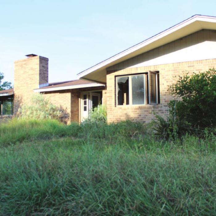 This is one of several houses on the golf course in La Grange that have not been lived in since Hurricane Harvey flooded them nearly three years ago.