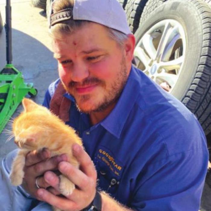 Ryan Vasek with one of the rescued kittens.