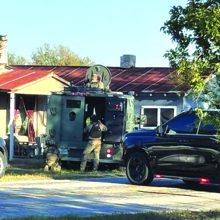 Members of the Austin County Special Response Team assisted Fayette County Sheriff’s Investigators with arresting the suspect from a brutal assault that happened in Clear Lake Pines on Thursday afternoon. The suspect was found hiding in an attic crawlspace of a building in Winch ester. Photo courtesy of the Fayette County Sheriff’s Office