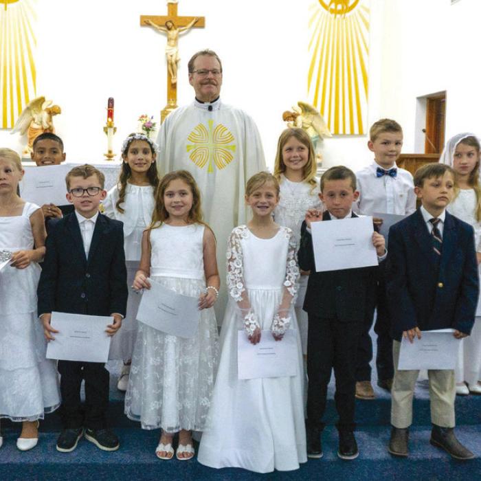 The Plum, Hostyn First Communion was held on Sunday, May 11. Pictured back from left: Teacher Monica Muras, Wyatt Wischnewsky, Bryan Toro, Abigail Acosta Reyes, Father Eddie Winkler, Ruth Brugger, Jaxon Hromadka, Faith Kimball, Teacher Brianne Bernsen; front row: Roman Veitch, Allie Zbranek, Jordy Zaruba, Shelby Janacek, Quinn Hatfield, Lucas Gommert, and Barrett Bernsen. Photo by Colton Brugger