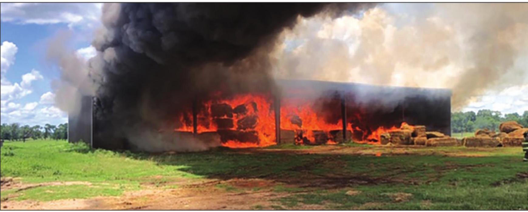 This photo shows the hundreds of hay bales at the Banks Ranch ablaze Tuesday afternoon. Photo courtesy of Fayette County Sheriff's Department