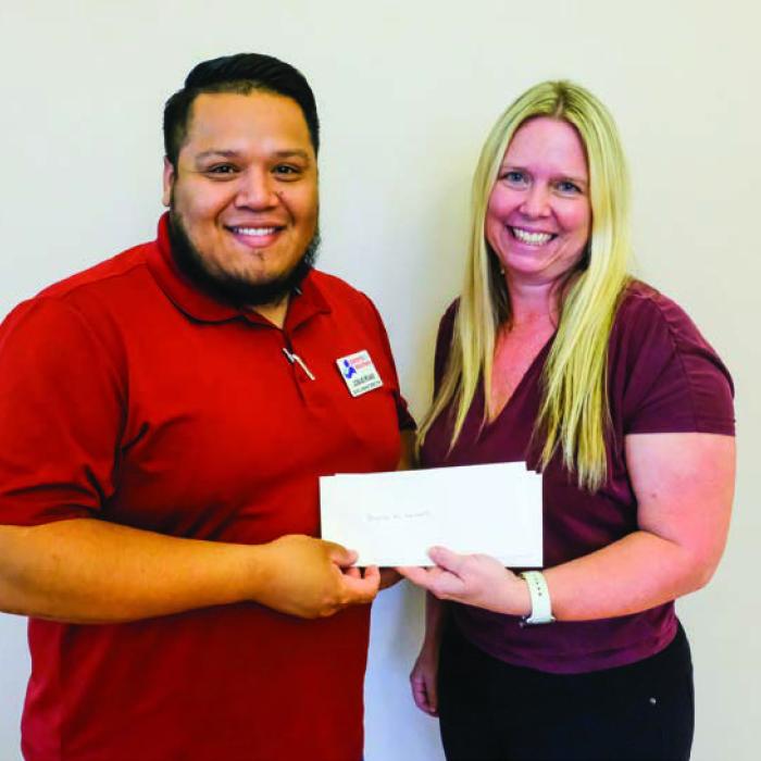 Parents as Teachers (PAT) received a $2,000 grant from the Texas Women’s League. Pictured are Josue Rivas of PAT (left) and Mindy Davis of TWL.