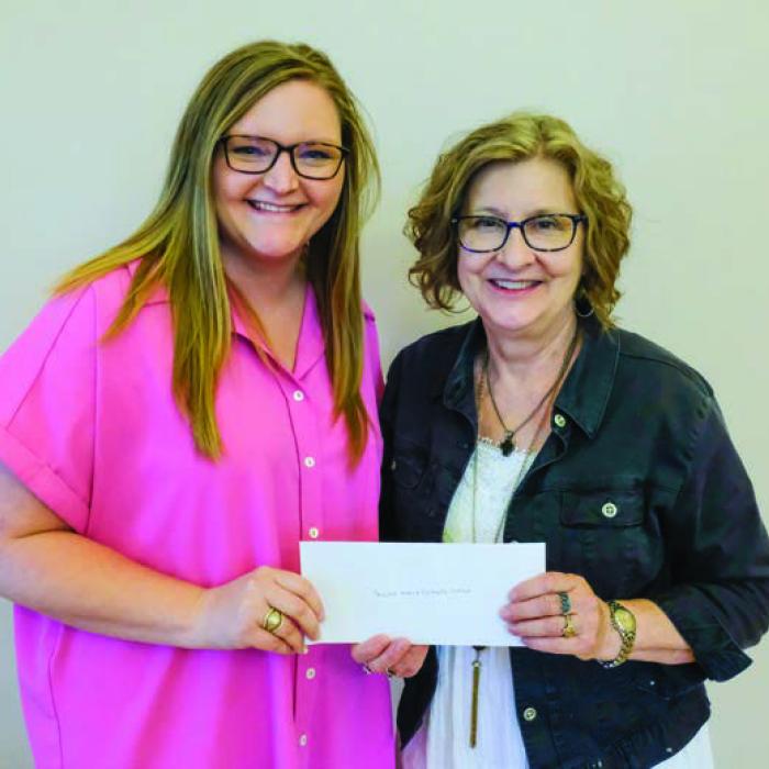 Sacred Heart Catholic School received a $2,000 grant from the Texas Women’s League. Pictured are Kristen Vandever of TWL (left) and Cindy Fletcher of Sacred Heart.