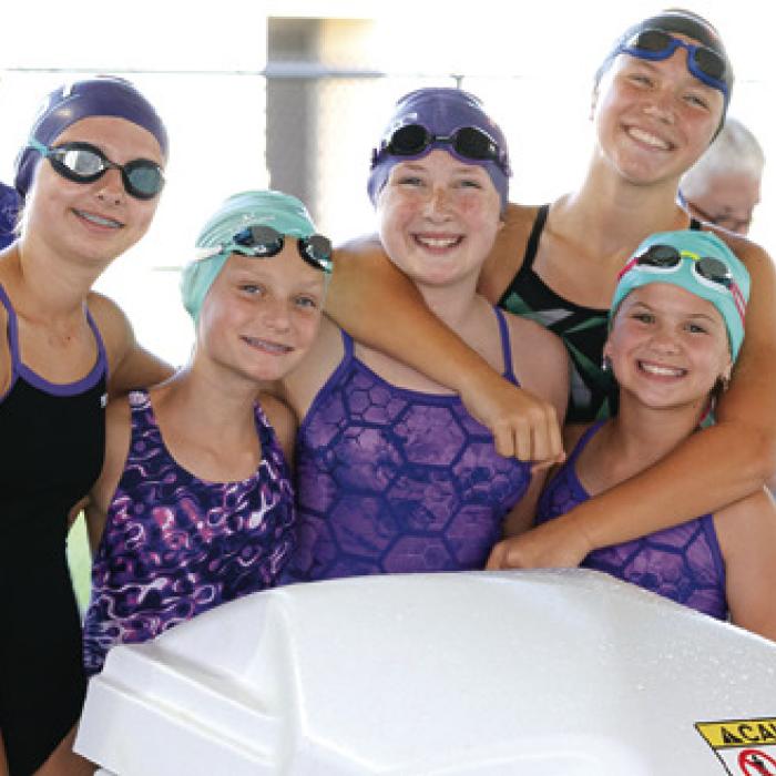 11-12-year-old FAST Team members celebrating their victories at the Meet of Champs.