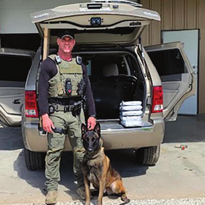 Sgt. Randy Thumann of the Fayette County Sheriff’s Office and his K9 partner Kolt seized an estimated $100 million worth of the deadly drug Fentanyl during a traffic stop last week. The bricks of drugs featured a symbol believed to be the brand mark of a drug cartel.