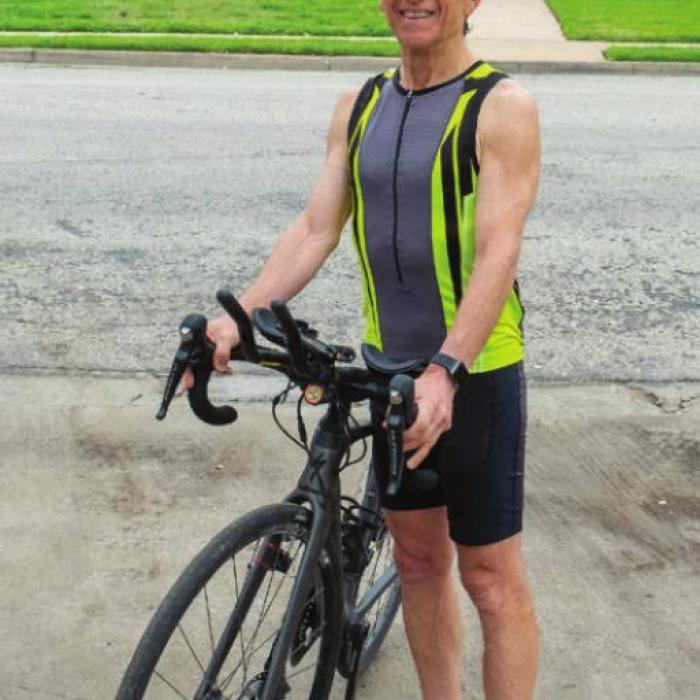 The president of the Pickleball Hall of Fame, Seymour “Rif” Rifkind, rode a bicycle into La Grange Wednesday as part of a 3,000 mile trek across America to raise funds for the Hall’s construction. Photo by Andy Behlen