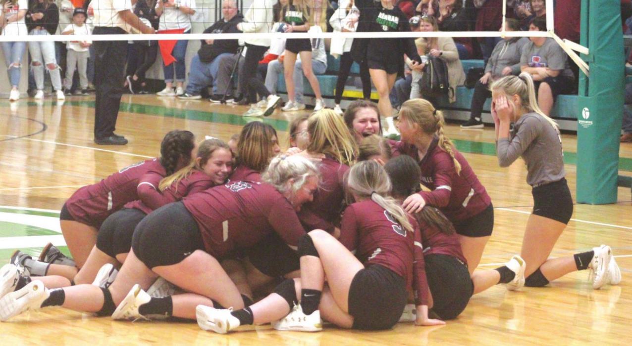 The members of the Fayetteville volleyball team dog-pile on one another in celebration at mid-court after the final point of their victory over Round Top-Carmine Saturday. Photo by Brian Pierson