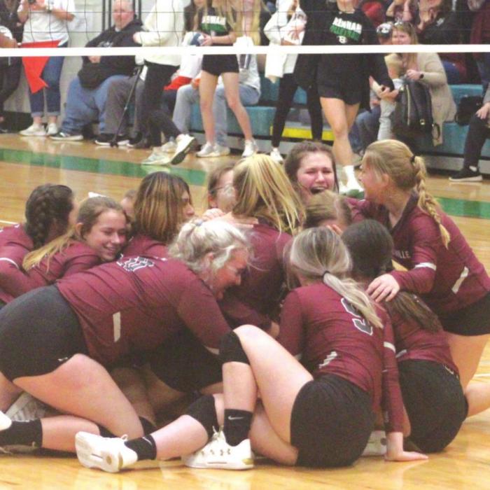 The members of the Fayetteville volleyball team dog-pile on one another in celebration at mid-court after the final point of their victory over Round Top-Carmine Saturday. Photo by Brian Pierson