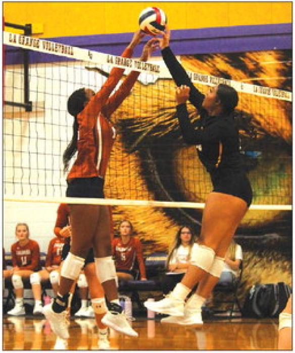 La Grange’s Cara Homer battles at the net with a Caldwell player in Tuesday’s match. Photo by Jeff Wick