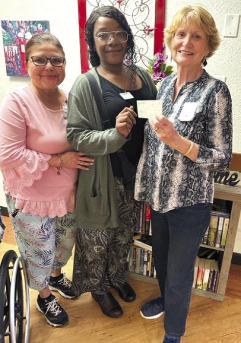 Mt. Calvary Lutheran Church Mary Martha Guild donated money to be used for Halloween candy for the residents to hand out to children who come by on Halloween. Pictured are Irma De La Cruz, Activity Director; Chandra Polk, Administrator; and Janice Teinert representing Mount Calvary.