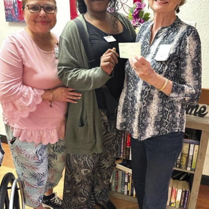 Mt. Calvary Lutheran Church Mary Martha Guild donated money to be used for Halloween candy for the residents to hand out to children who come by on Halloween. Pictured are Irma De La Cruz, Activity Director; Chandra Polk, Administrator; and Janice Teinert representing Mount Calvary.