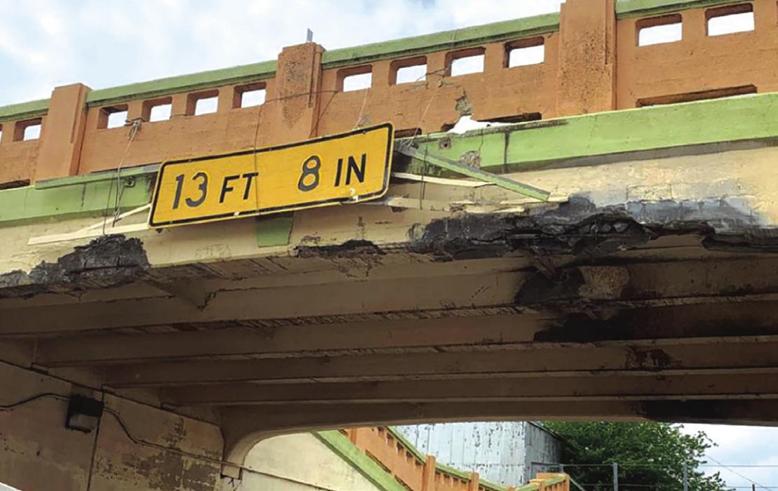 A tall load traveling on US 77 struck the underpass in Schulenburg Wednesday afternoon, April 20. The impact knocked down several chunks of concrete from the bridge overhead, one of several recent issues at the location. Record File Photo