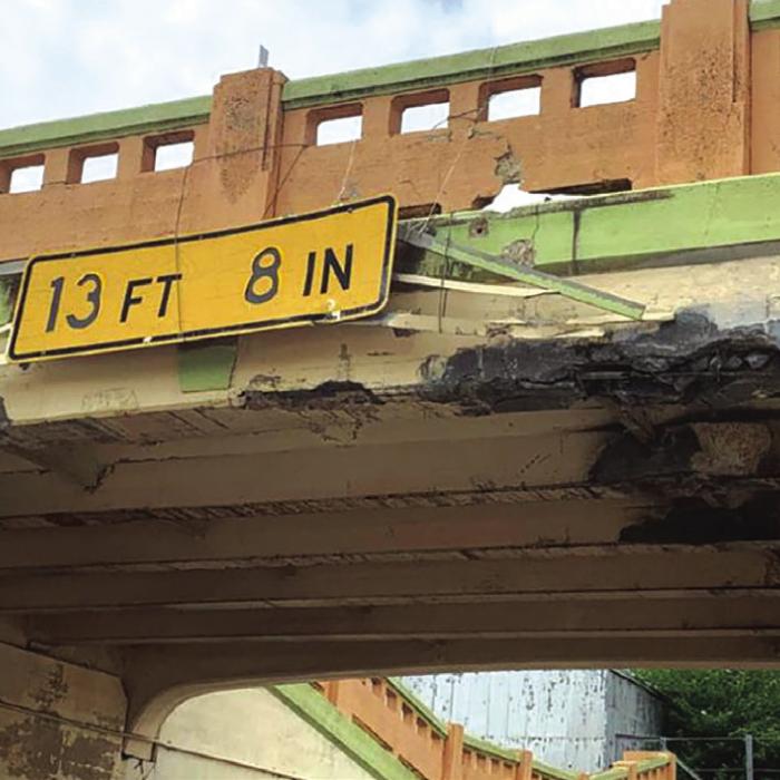A tall load traveling on US 77 struck the underpass in Schulenburg Wednesday afternoon, April 20. The impact knocked down several chunks of concrete from the bridge overhead, one of several recent issues at the location. Record File Photo