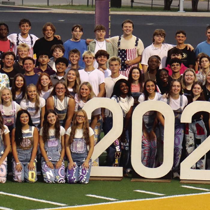 The members of the senior class of 2027 at La Grange High School gathered on the field for the Senior Sunrise event before the first day of school Wednesday. Photo by Lucy Carr