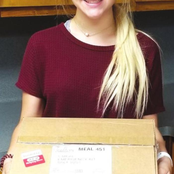 MOWRCA student worker Kristen Wilson helping at Meals on Wheels