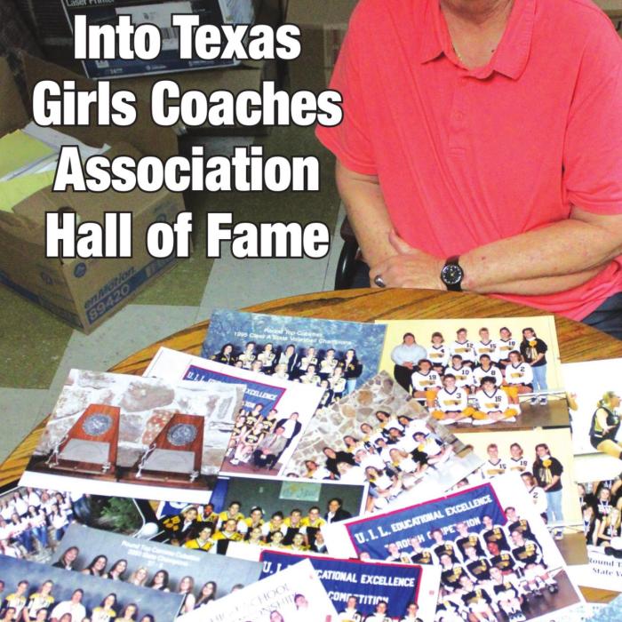 Tanya Nygrin with some of the team photos she has of her state qualifying volleyball teams.