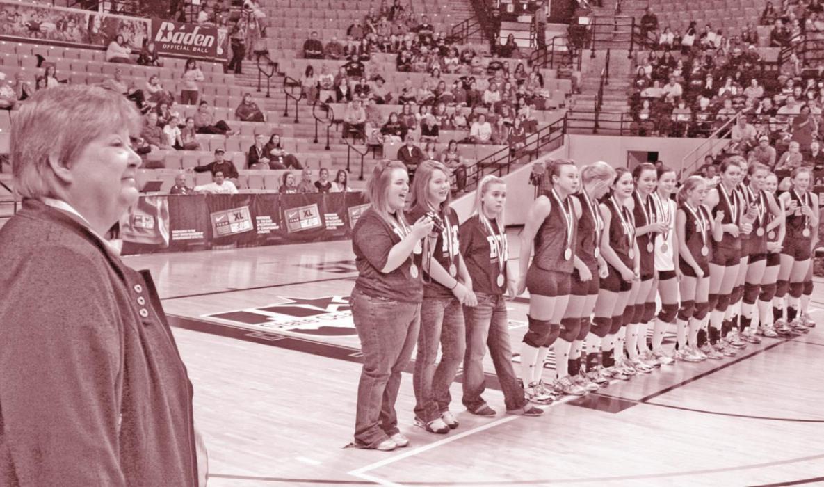 Tanya Nygrin looks on as her 2010 Cubettes are introduced as state champions. Photos by Jeff Wick