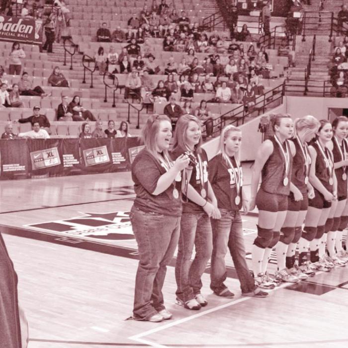 Tanya Nygrin looks on as her 2010 Cubettes are introduced as state champions. Photos by Jeff Wick