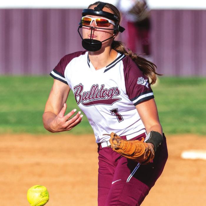 Flationia’s Ali Janecka strikes out a Bloomington batter in Tuesday’s district game. Janecka threw a no-hitter. Photo by Stephanie Steinhauser