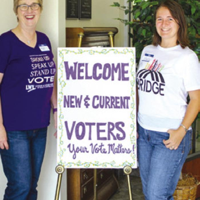 Pictured is Peggy Halamicek (League of Women Voters) and Liberty Sirilo (BRIDGE). Photo by Jessica Montez