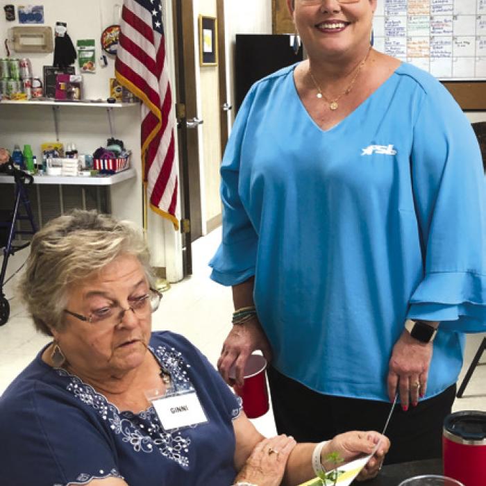 Cheryl Brossmann with Fayette Savings visited recently to call our bingo game; she is pictured here with Ginni Berwick.