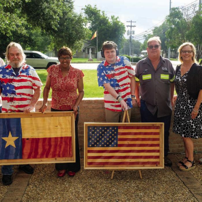 Local Craftsman Donates Wooden Flags for City Hall