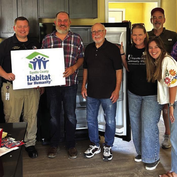 The Rotary Club of La Grange donated the funds to purchase the refrigerator, microwave, range/ oven and washer/dryer for the newest Habitat for Humanity home. Pictured here are Rotary members Kyle Hartmann, President Elect-Josh Vandever, Kenny Couch, La Grange Habitat for Humanity CEO, Mike Coppinger, Heather Barthelme, Ashleigh Parks, Randy Albers, and Rob Muil.