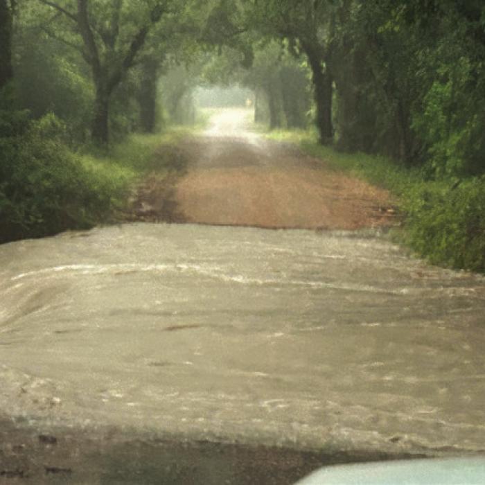 Pct. 4 Commissioner Drew Brossmann took this photos of the floodwaters from Friday’s storm inundating the low water crossings in Precinct 4. The flooding rendered some roads impassable in the Ammannsville, Swiss Alp, Holman, and Mullins Prairie areas.