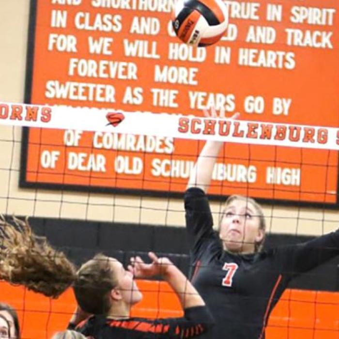 Schulenburg’s Kloe Kutac prepares to spike the ball after the set from Tamara Otto in Friday’s win over Industrial. Photo by Audrey Kristynik